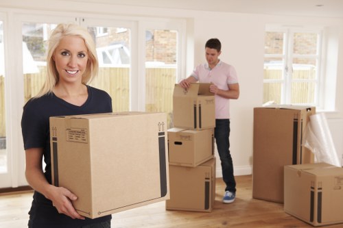 Professional flat removals in Stjohns with packed boxes and moving support
