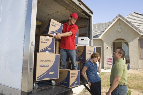 Preparing for office removals in Stjohns with labeled boxes and checklist