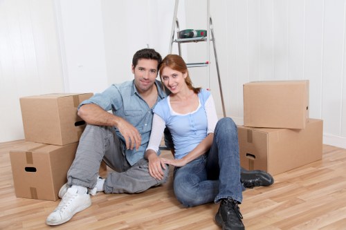 Professional movers handling compact household items during a small removal