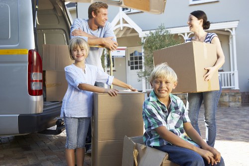 Local Stjohns removals team packing household items carefully